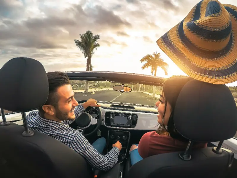 Couple Driving Convertible In Tenerife