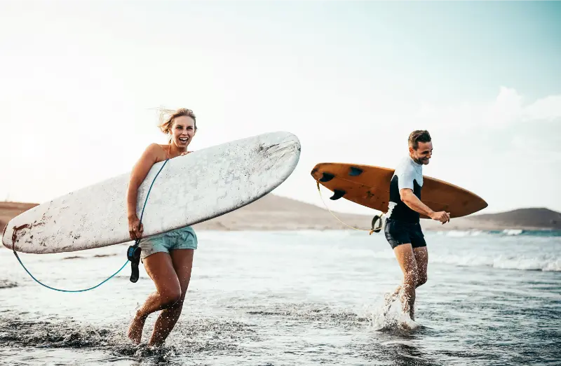 Surfers On A Tenerife Beach